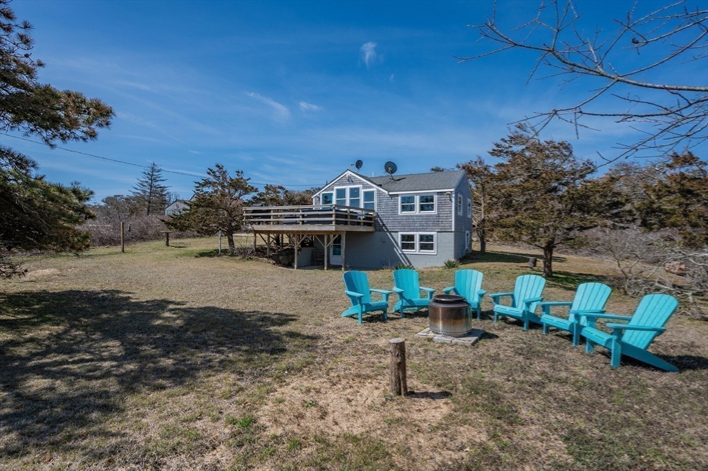315 R Nauset Light Beach Road Eastham, MA 02642 - Photo 24 of 28 a front view of a house with garden