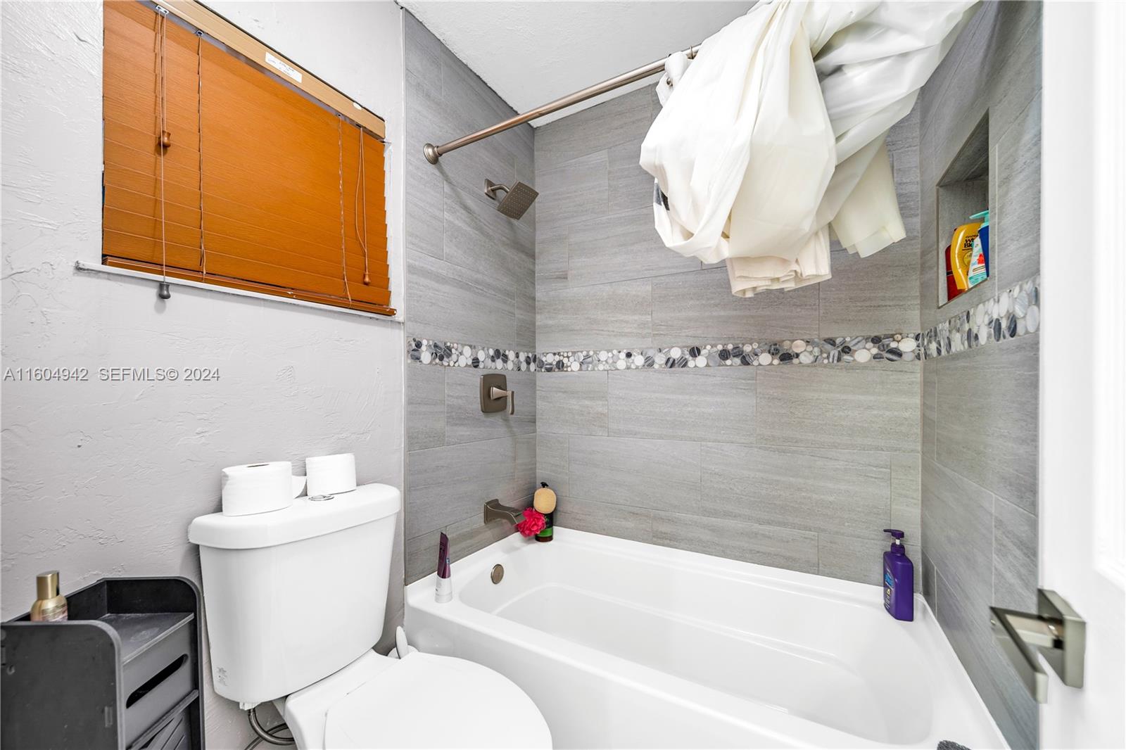 875 East 29th Street Hialeah, FL 33013 - Photo 11 of 38 a bathroom with a sink and a mirror
