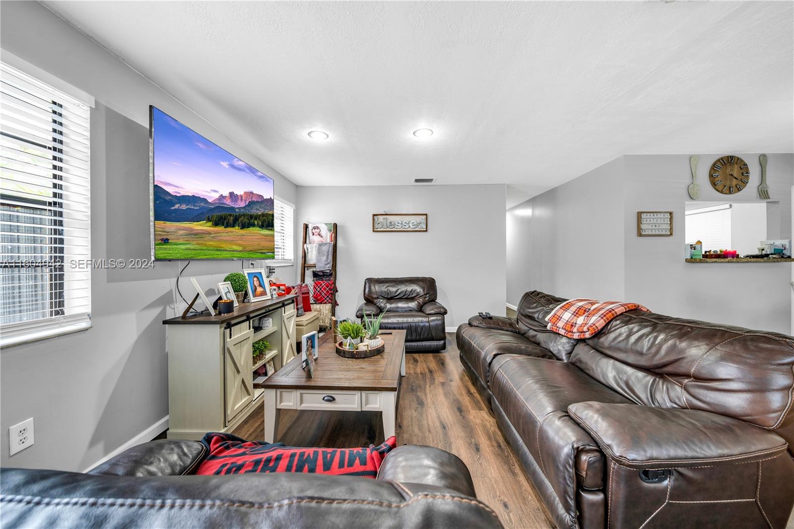 875 East 29th Street Hialeah, FL 33013 - Photo 16 of 38 a living room with furniture and a flat screen tv