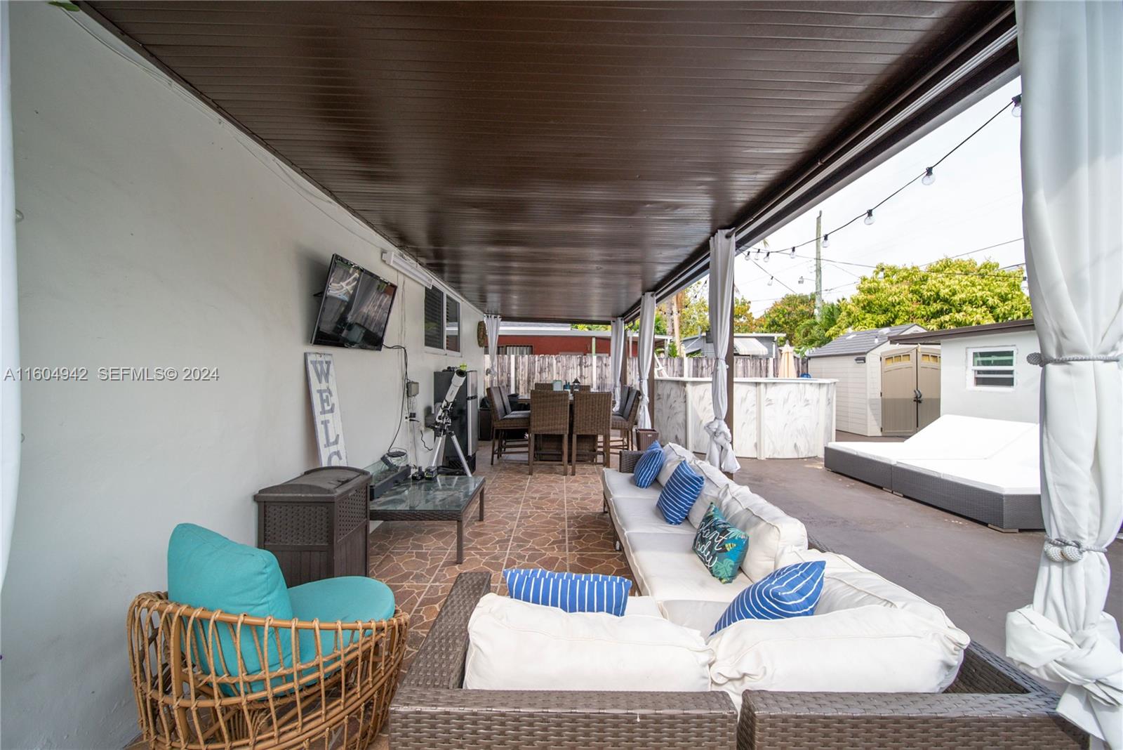 875 East 29th Street Hialeah, FL 33013 - Photo 19 of 38 a living room with patio furniture and a wooden floor