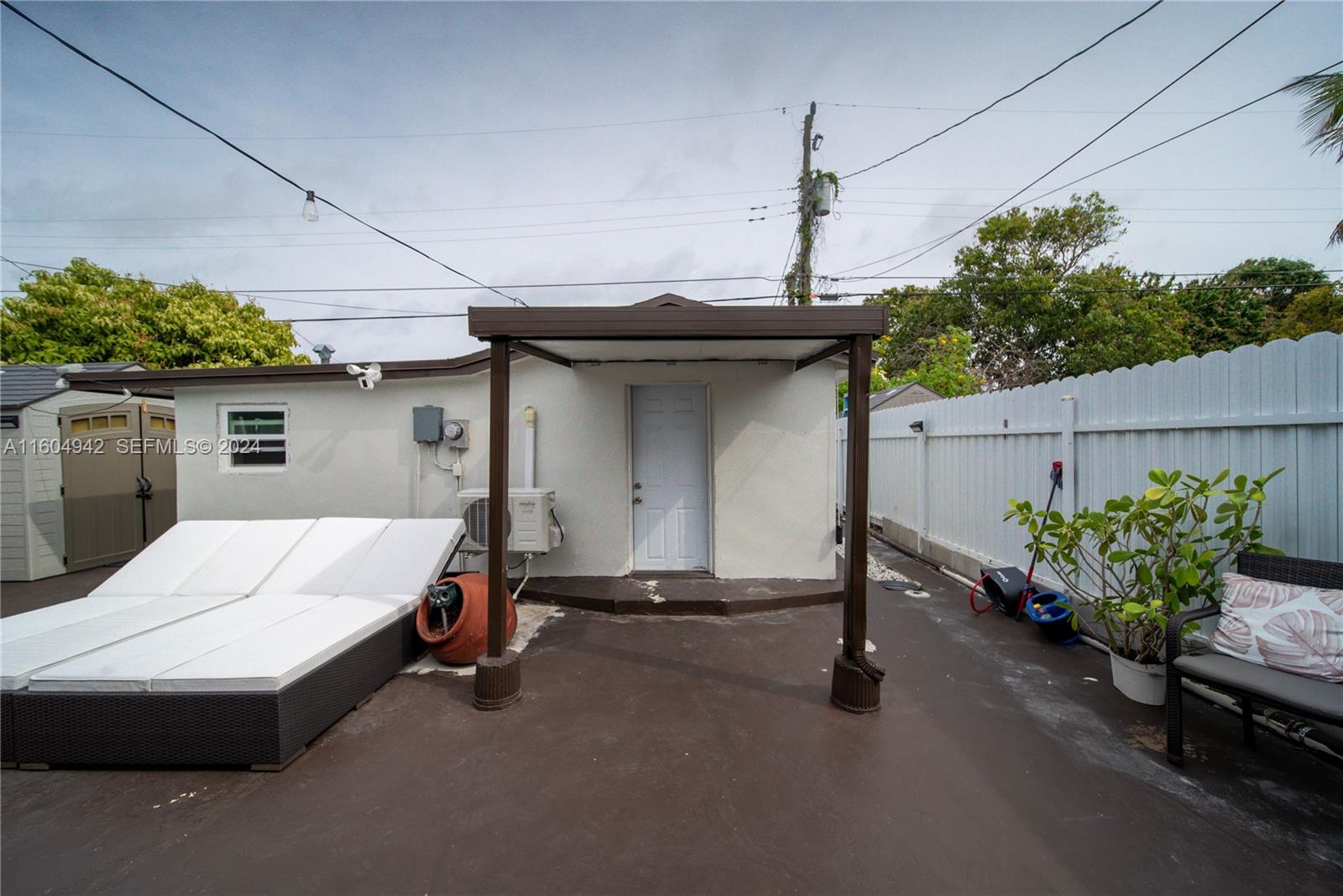 875 East 29th Street Hialeah, FL 33013 - Photo 21 of 38 a bed room with a bed and a table