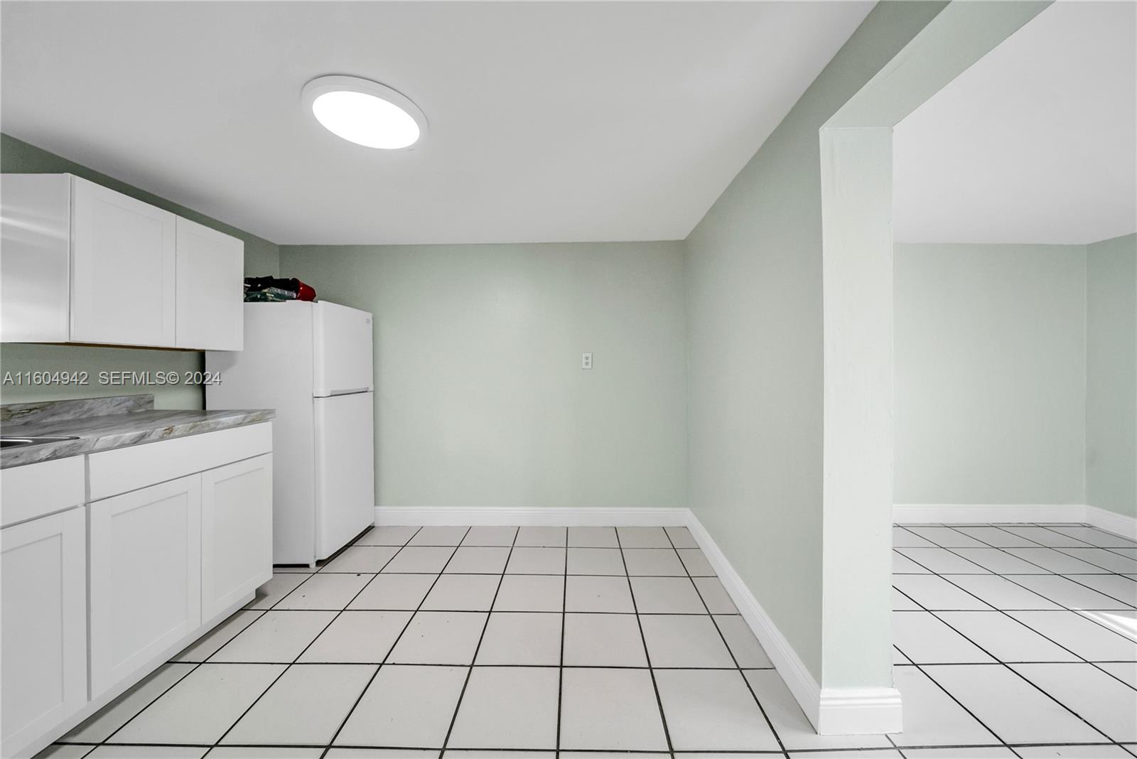 875 East 29th Street Hialeah, FL 33013 - Photo 24 of 38 a view of a kitchen with white cabinets