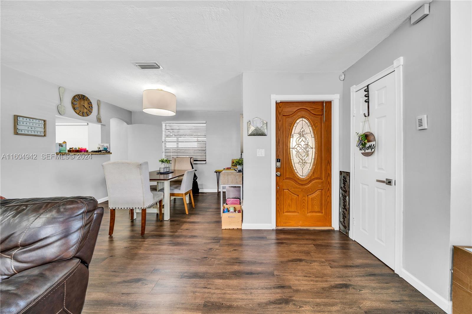 875 East 29th Street Hialeah, FL 33013 - Photo 4 of 38 a living room with furniture and wooden floor