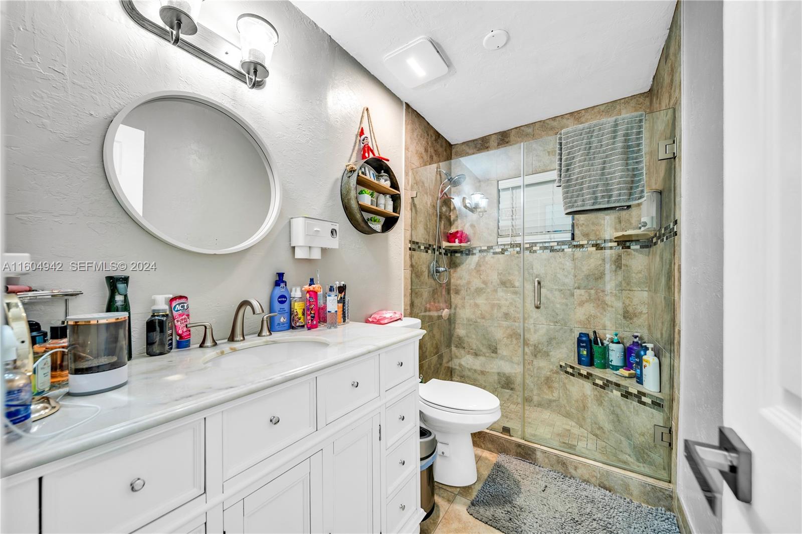 875 East 29th Street Hialeah, FL 33013 - Photo 8 of 38 a bathroom with a sink a toilet and a shower