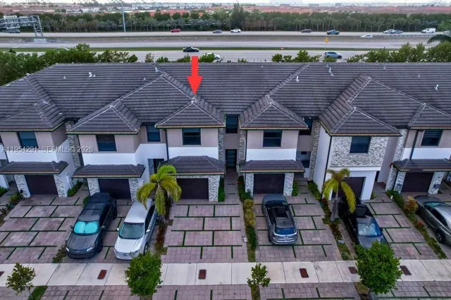a aerial view of a house with garden and plants