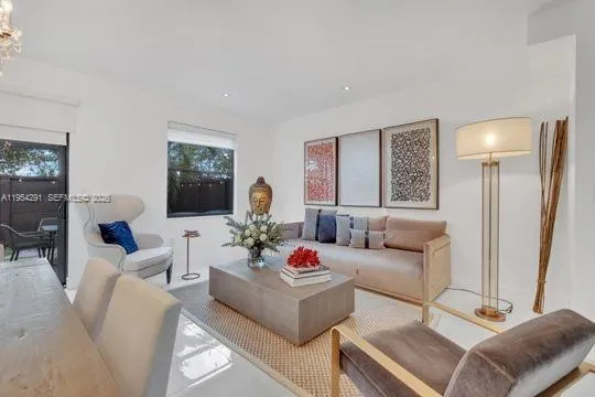 a living room with furniture or couch and a flat screen tv