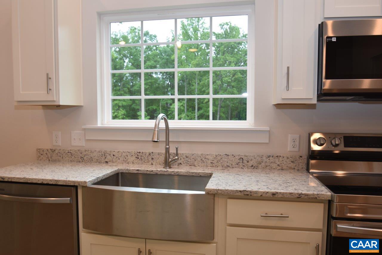 88 Martin Village Road, Unit MV 16D Louisa, VA 23093 - Photo 12 of 37 a kitchen with granite countertop a sink and a stove
