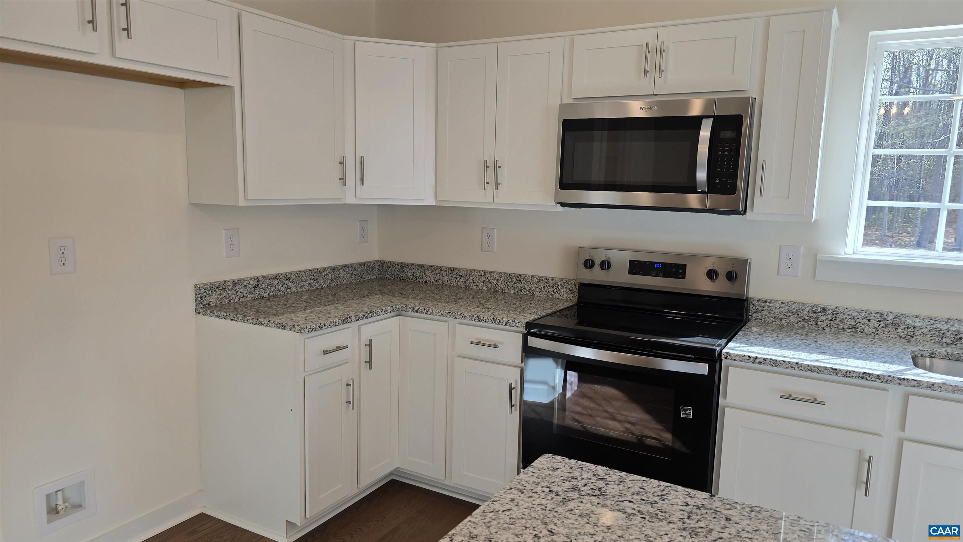 88 Martin Village Road, Unit MV 16D Louisa, VA 23093 - Photo 12 of 41 a kitchen with a stove and a microwave