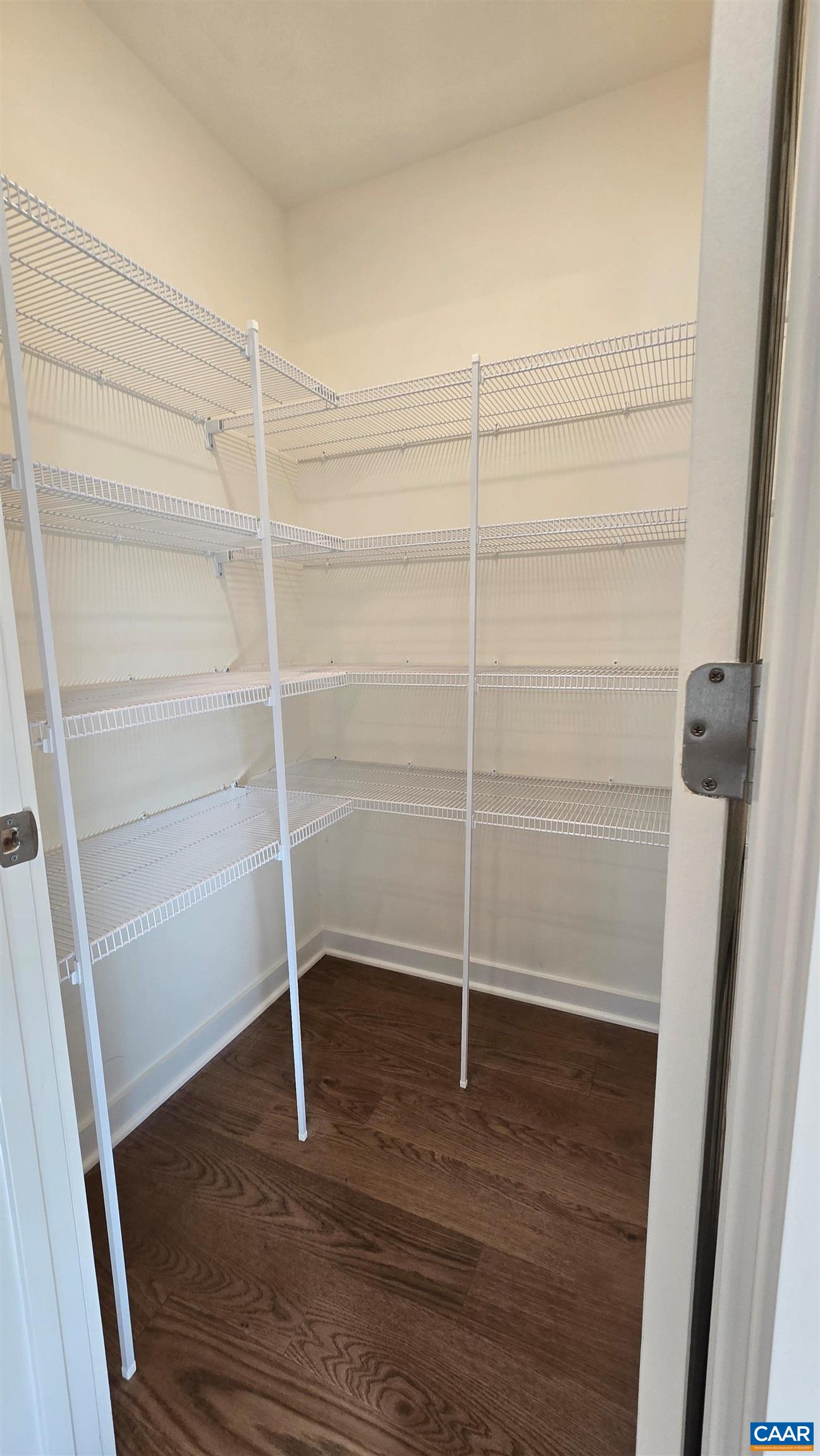 88 Martin Village Road, Unit MV 16D Louisa, VA 23093 - Photo 15 of 41 a room with walk in closet and wooden floor