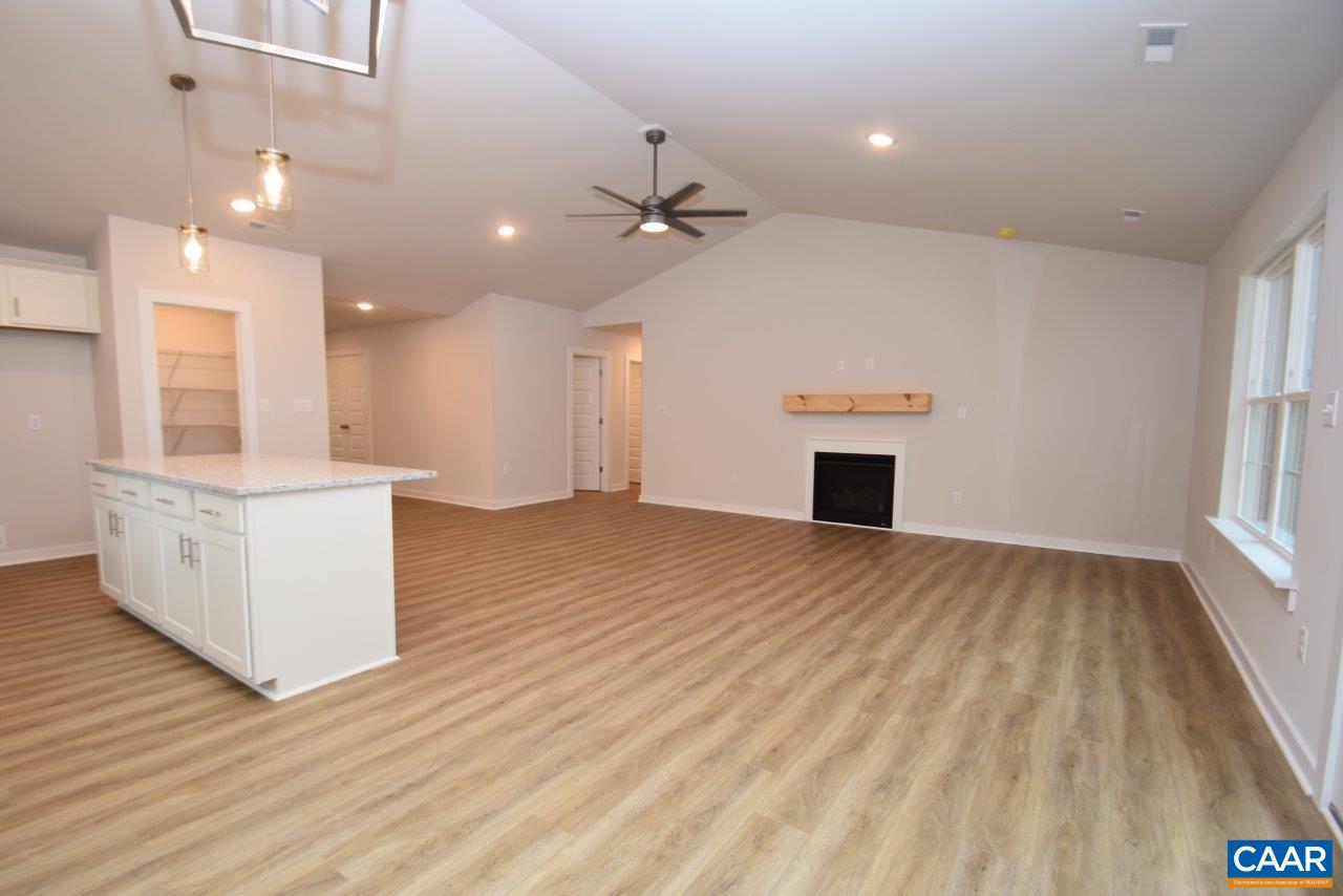 88 Martin Village Road, Unit MV 16D Louisa, VA 23093 - Photo 15 of 37 an empty room with wooden floor and windows