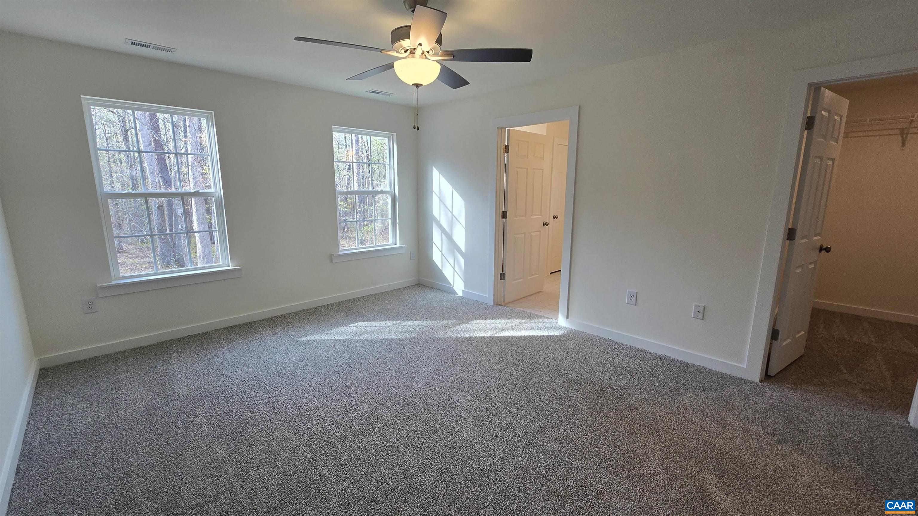 88 Martin Village Road, Unit MV 16D Louisa, VA 23093 - Photo 17 of 41 an empty room with windows and ceiling fan