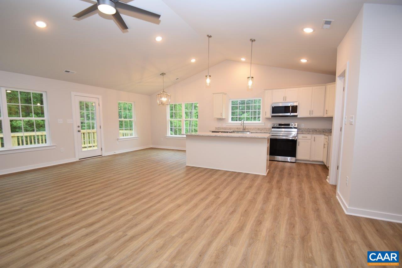88 Martin Village Road, Unit MV 16D Louisa, VA 23093 - Photo 20 of 37 a view of kitchen with kitchen island wooden floors and stainless steel appliances