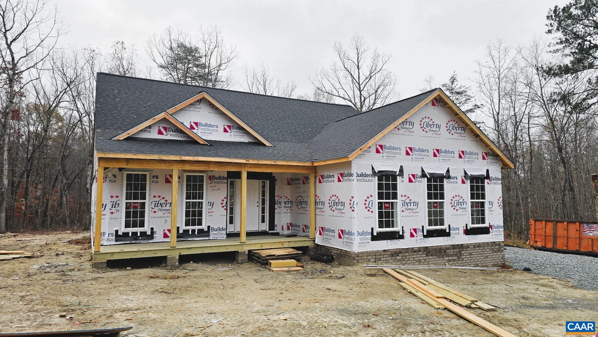 88 Martin Village Road, Unit MV 16D Louisa, VA 23093 - Photo 2 of 37 a view of a white house with large windows and wooden fence