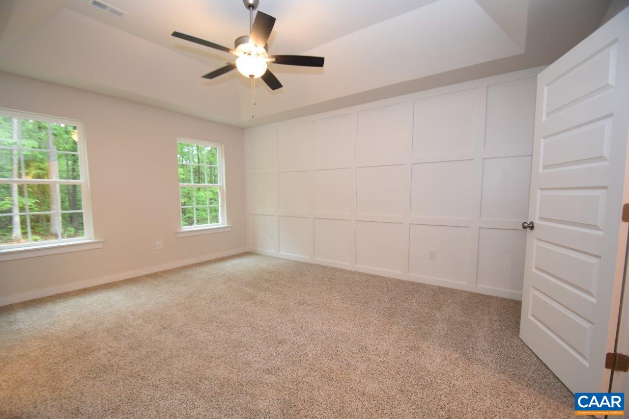88 Martin Village Road, Unit MV 16D Louisa, VA 23093 - Photo 23 of 37 an empty room with a window and a ceiling fan
