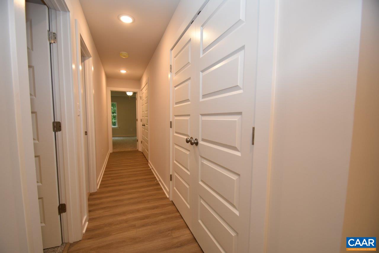 88 Martin Village Road, Unit MV 16D Louisa, VA 23093 - Photo 26 of 37 a view of a hallway with the wooden floor