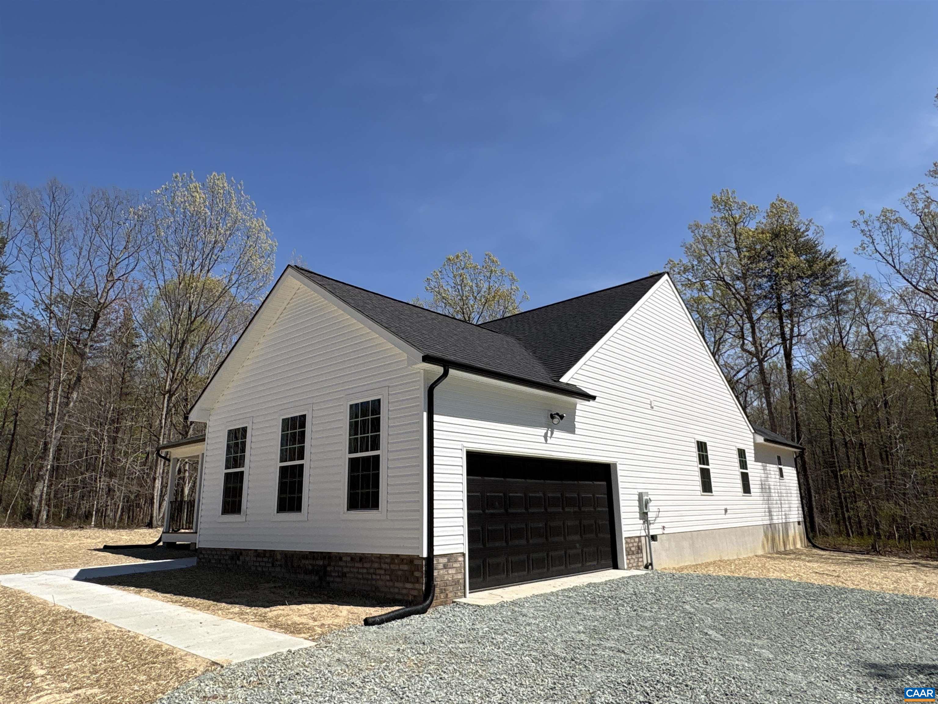 88 Martin Village Road, Unit MV 16D Louisa, VA 23093 - Photo 27 of 41 a front view of a house with a yard