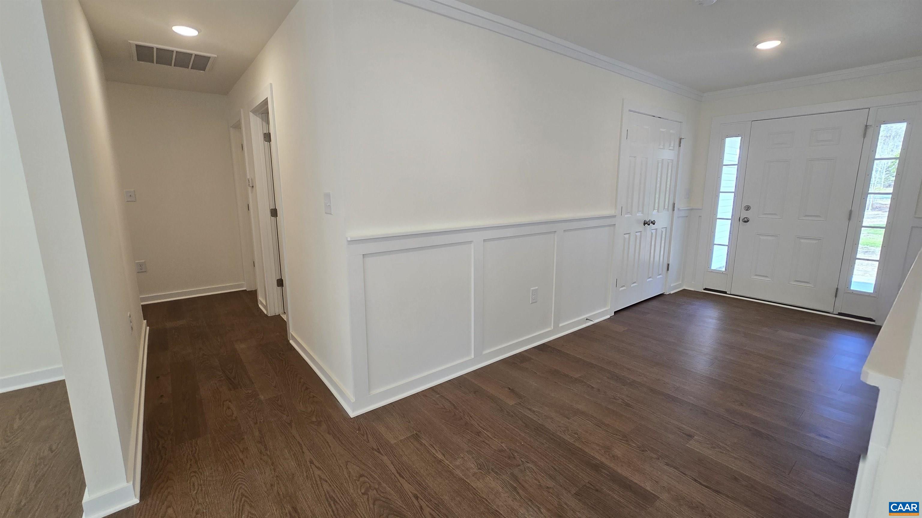 88 Martin Village Road, Unit MV 16D Louisa, VA 23093 - Photo 4 of 41 an empty room with wooden floor and entrance