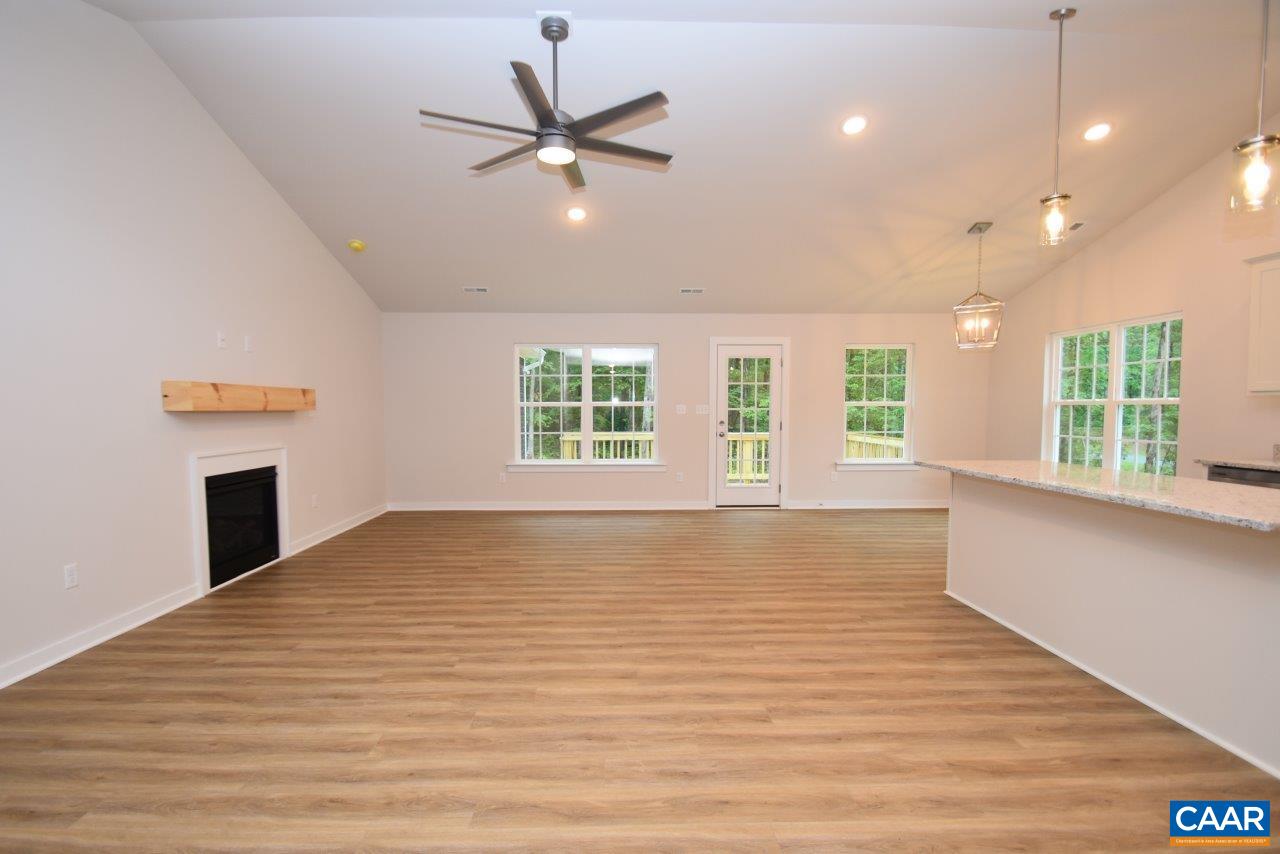 88 Martin Village Road, Unit MV 16D Louisa, VA 23093 - Photo 7 of 37 a view of an empty room with a window and wooden floor