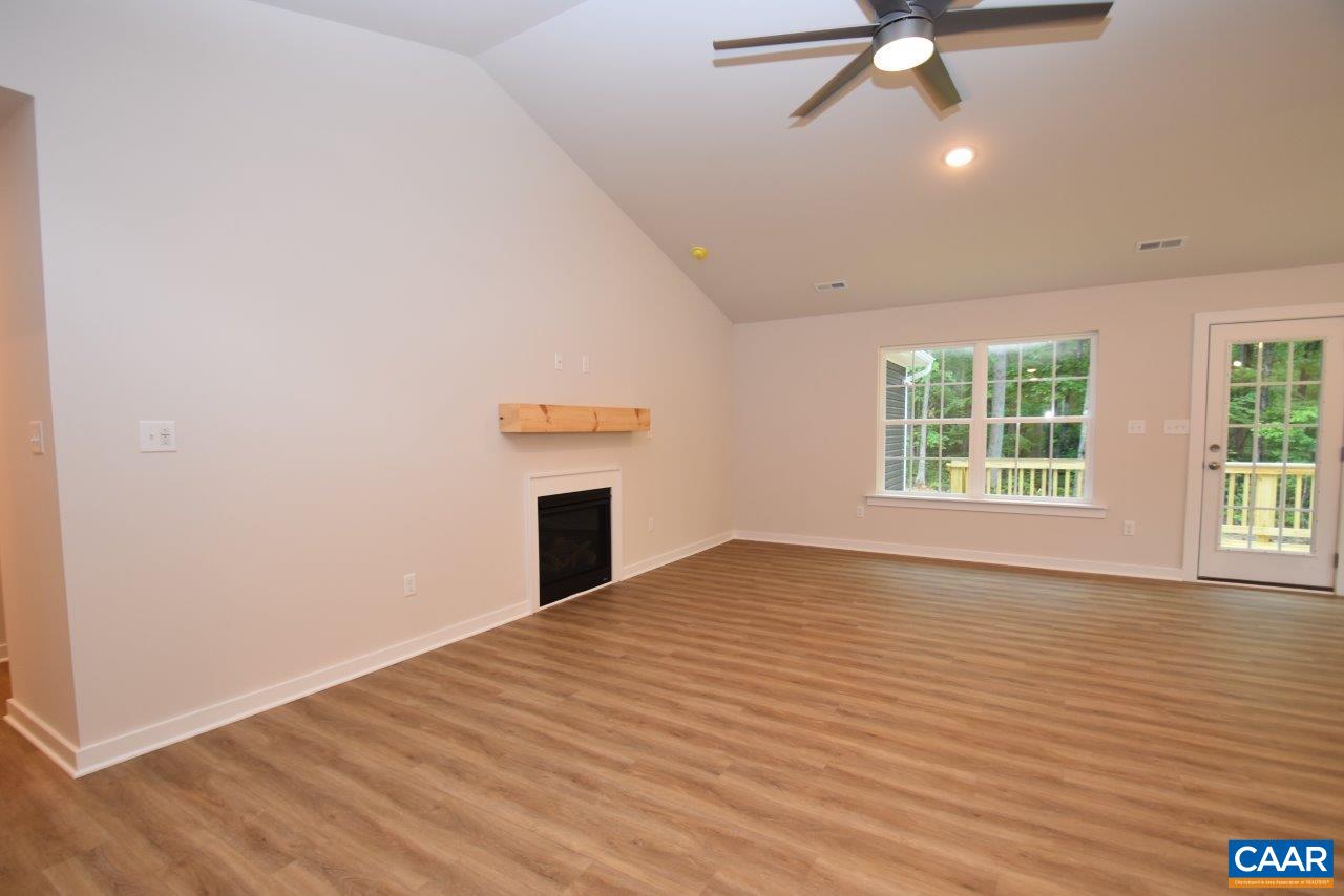 88 Martin Village Road, Unit MV 16D Louisa, VA 23093 - Photo 8 of 37 an empty room with wooden floor fan and windows