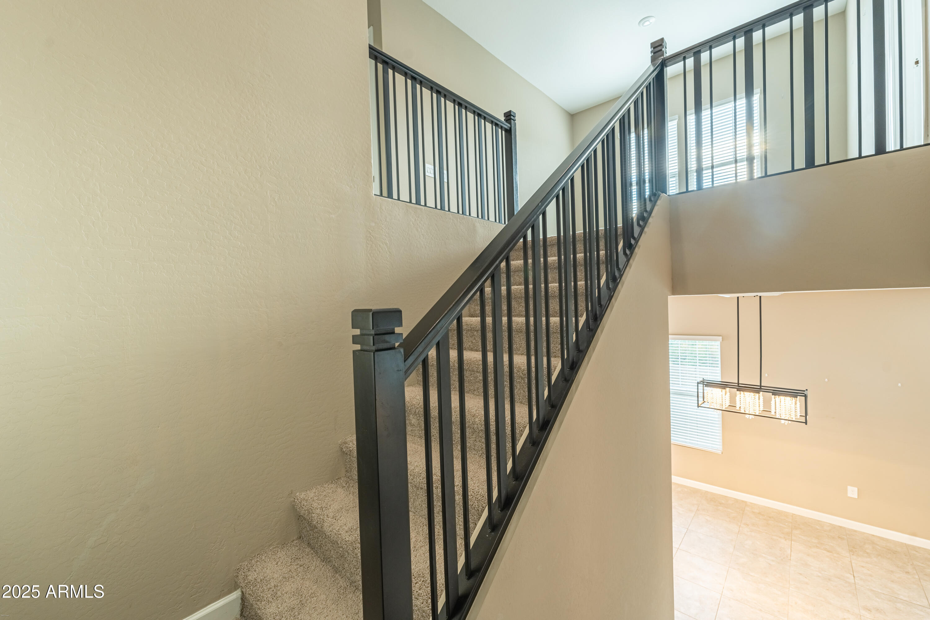 4838 East Helena Drive Scottsdale, AZ 85254 - Photo 11 of 32 a view of staircase with railing and white walls