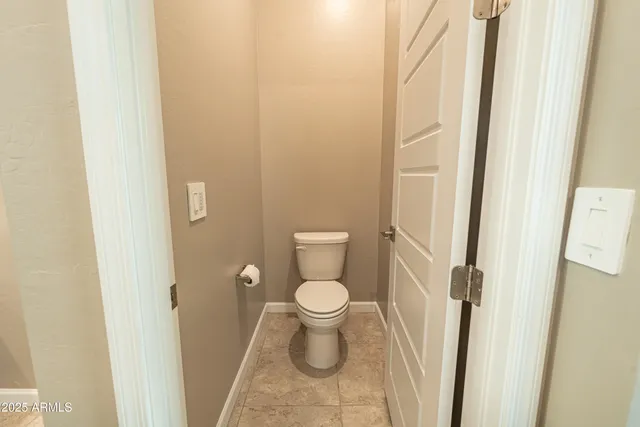 a bathroom with a double vanity sink toilet mirror and bathtub