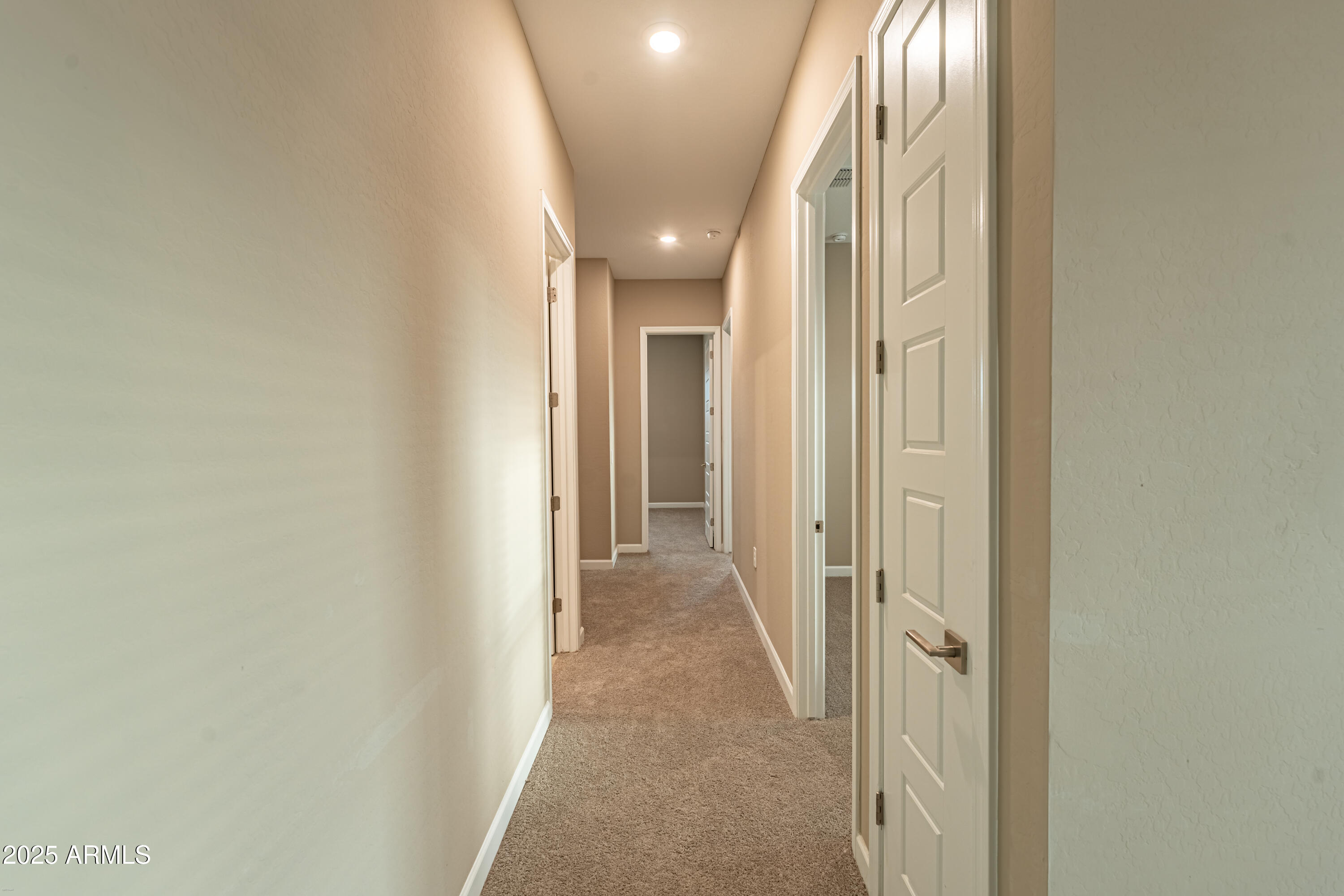 4838 East Helena Drive Scottsdale, AZ 85254 - Photo 23 of 32 view of a hallway with wooden floor and a chandelier