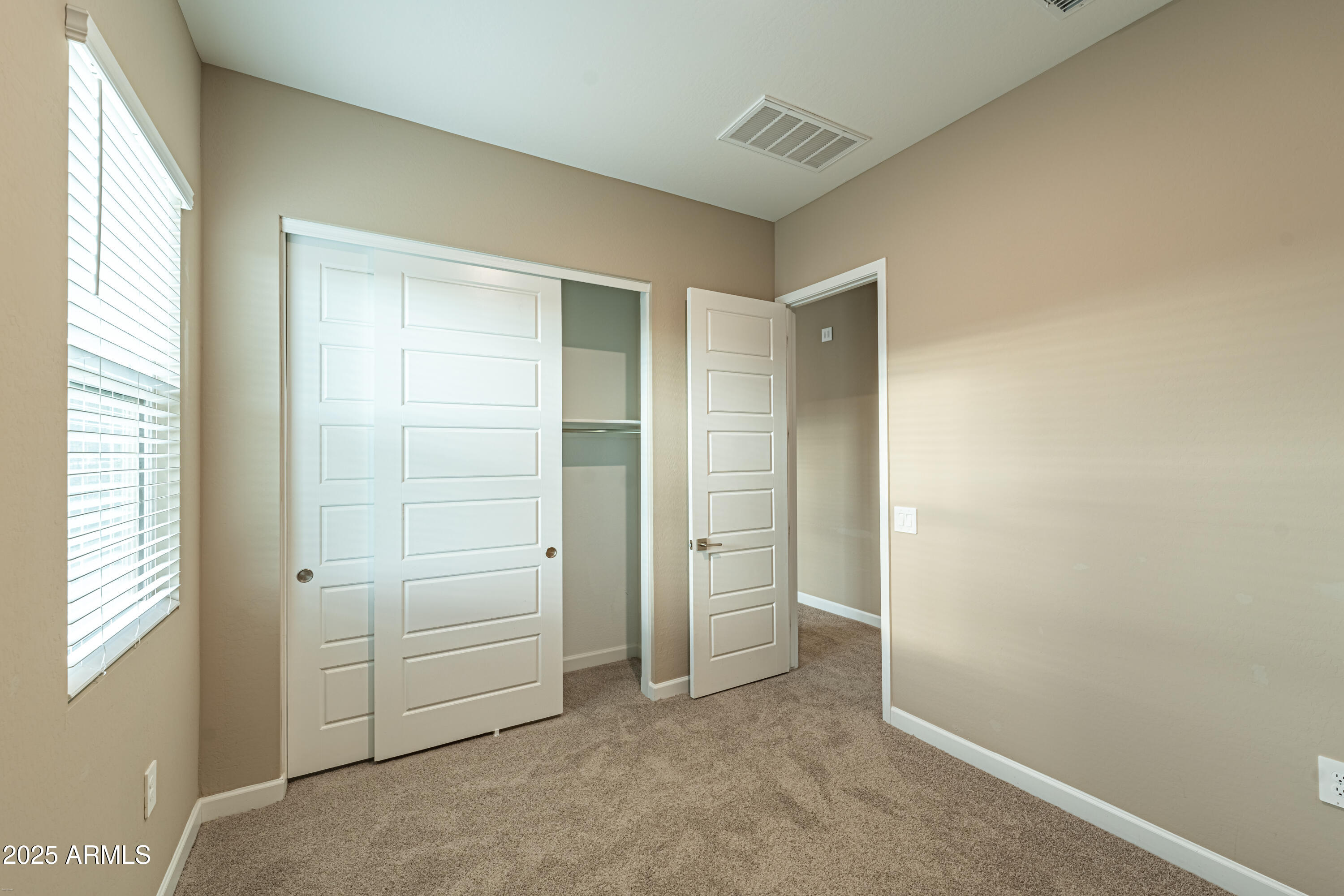4838 East Helena Drive Scottsdale, AZ 85254 - Photo 30 of 32 an empty room with windows and closet
