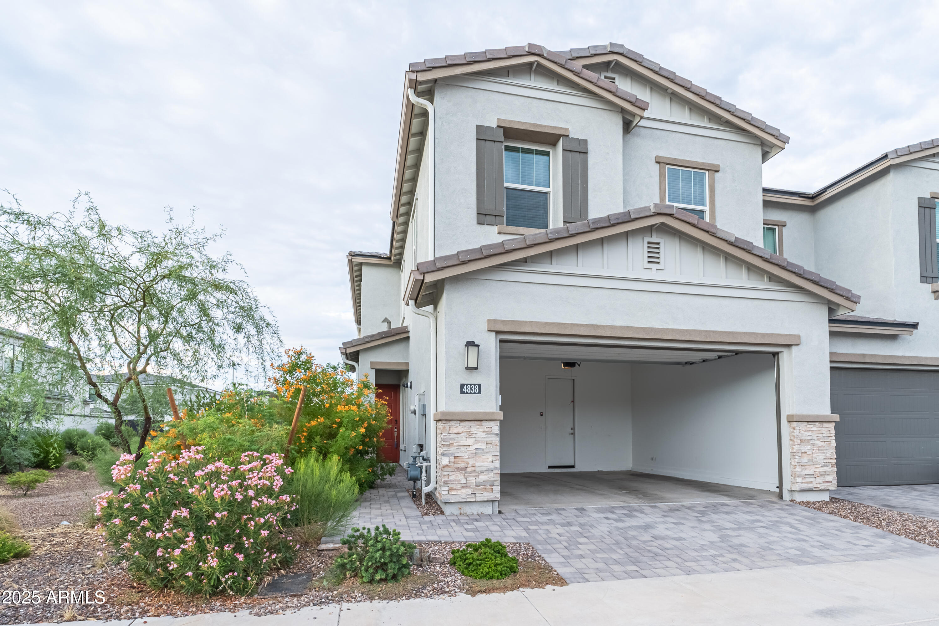 4838 East Helena Drive Scottsdale, AZ 85254 - Photo 32 of 32 a front view of a house with garden