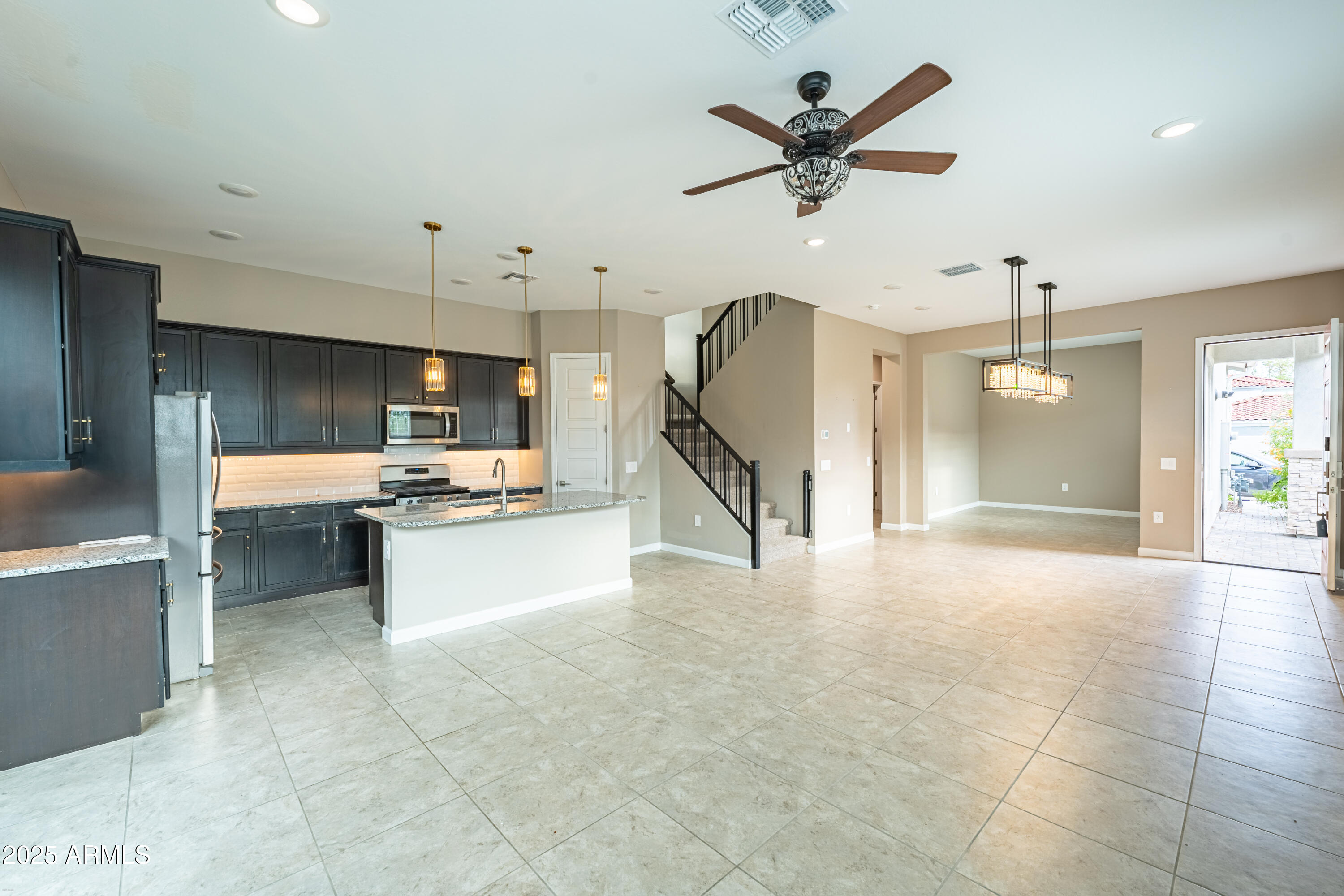 4838 East Helena Drive Scottsdale, AZ 85254 - Photo 4 of 32 a living room with kitchen and a ceiling fan