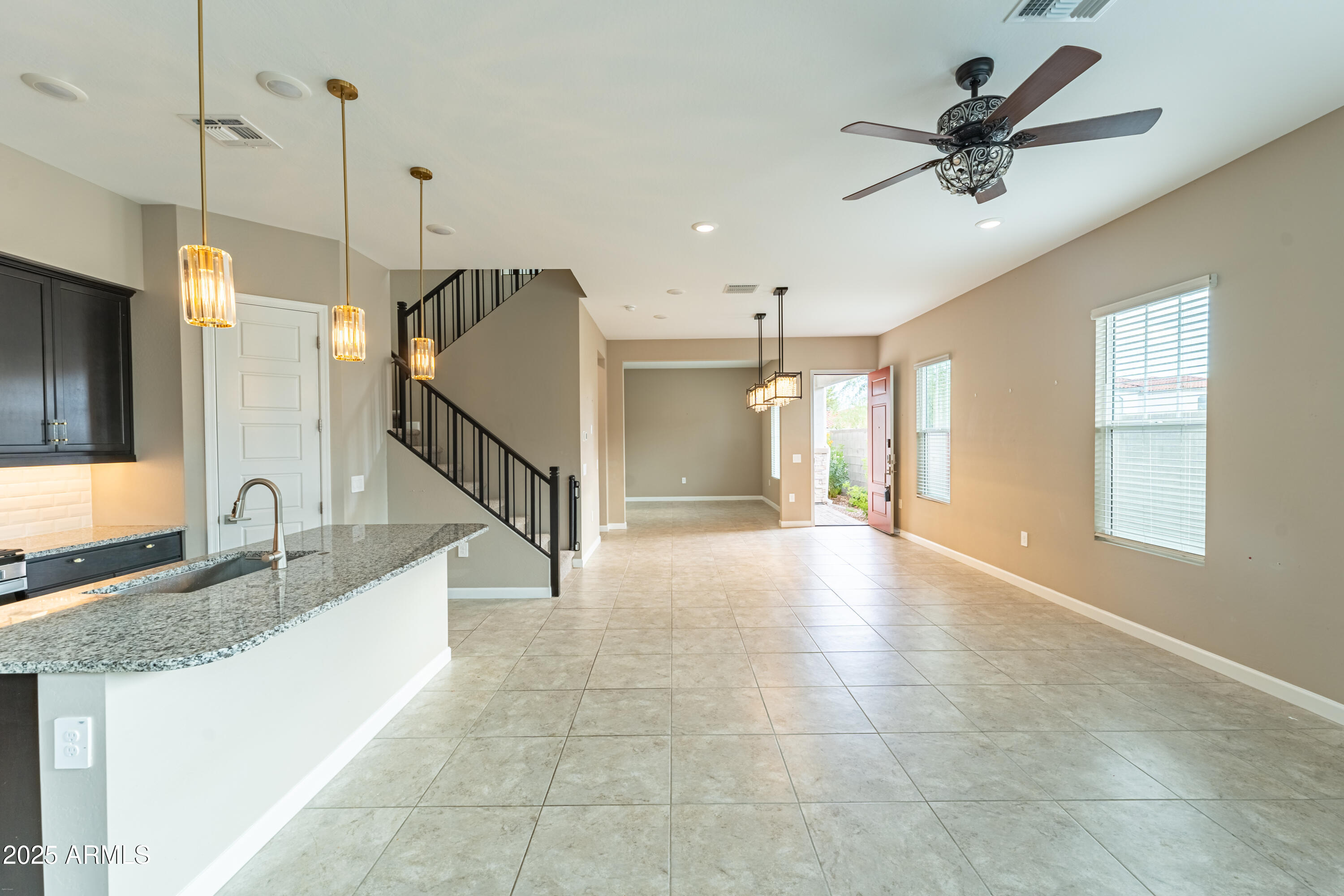 4838 East Helena Drive Scottsdale, AZ 85254 - Photo 6 of 32 a view of a kitchen with a sink and a chandelier