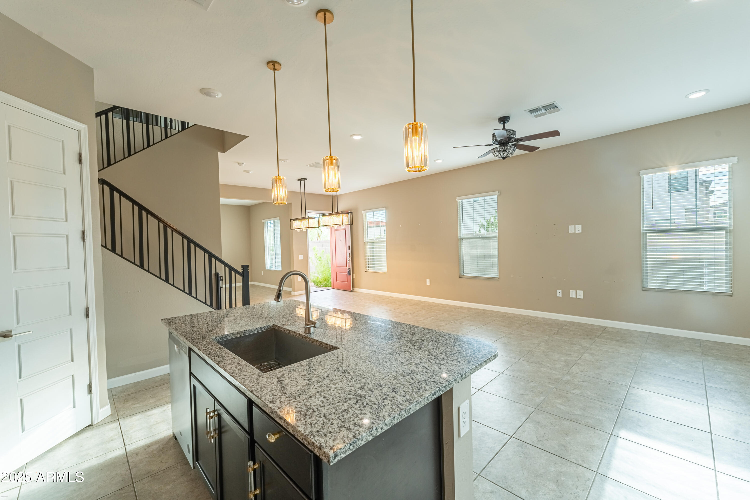 4838 East Helena Drive Scottsdale, AZ 85254 - Photo 10 of 32 a kitchen with kitchen island a sink a counter top space appliances and cabinets