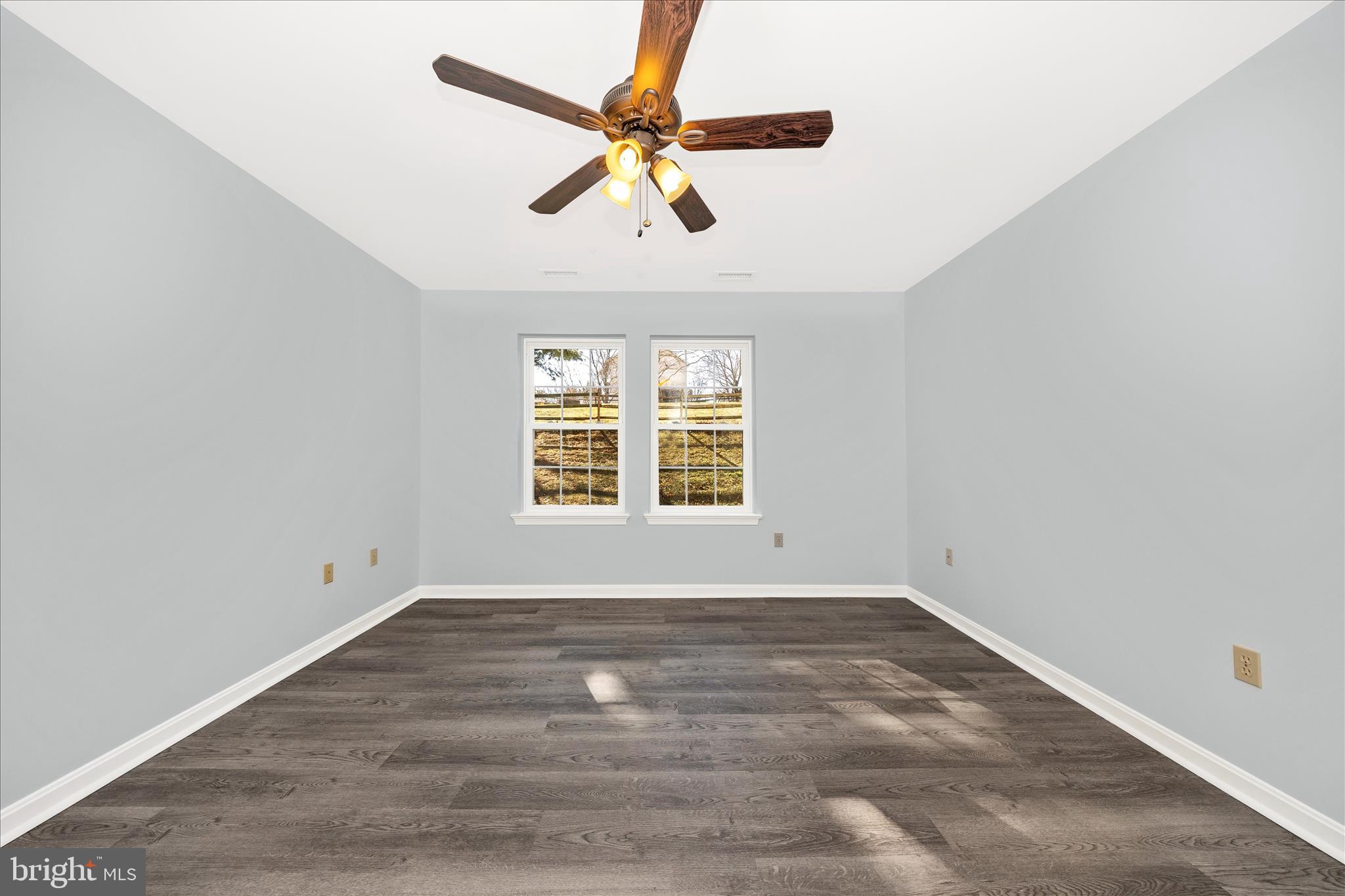 2402 Dominion Drive, Unit 1B Frederick, MD 21702 - Photo 21 of 66 wooden floor in an empty room with a window