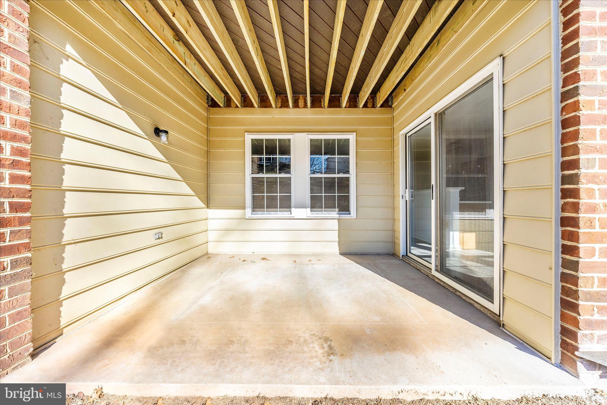 2402 Dominion Drive, Unit 1B Frederick, MD 21702 - Photo 48 of 66 a view of a house with a door and wooden floor