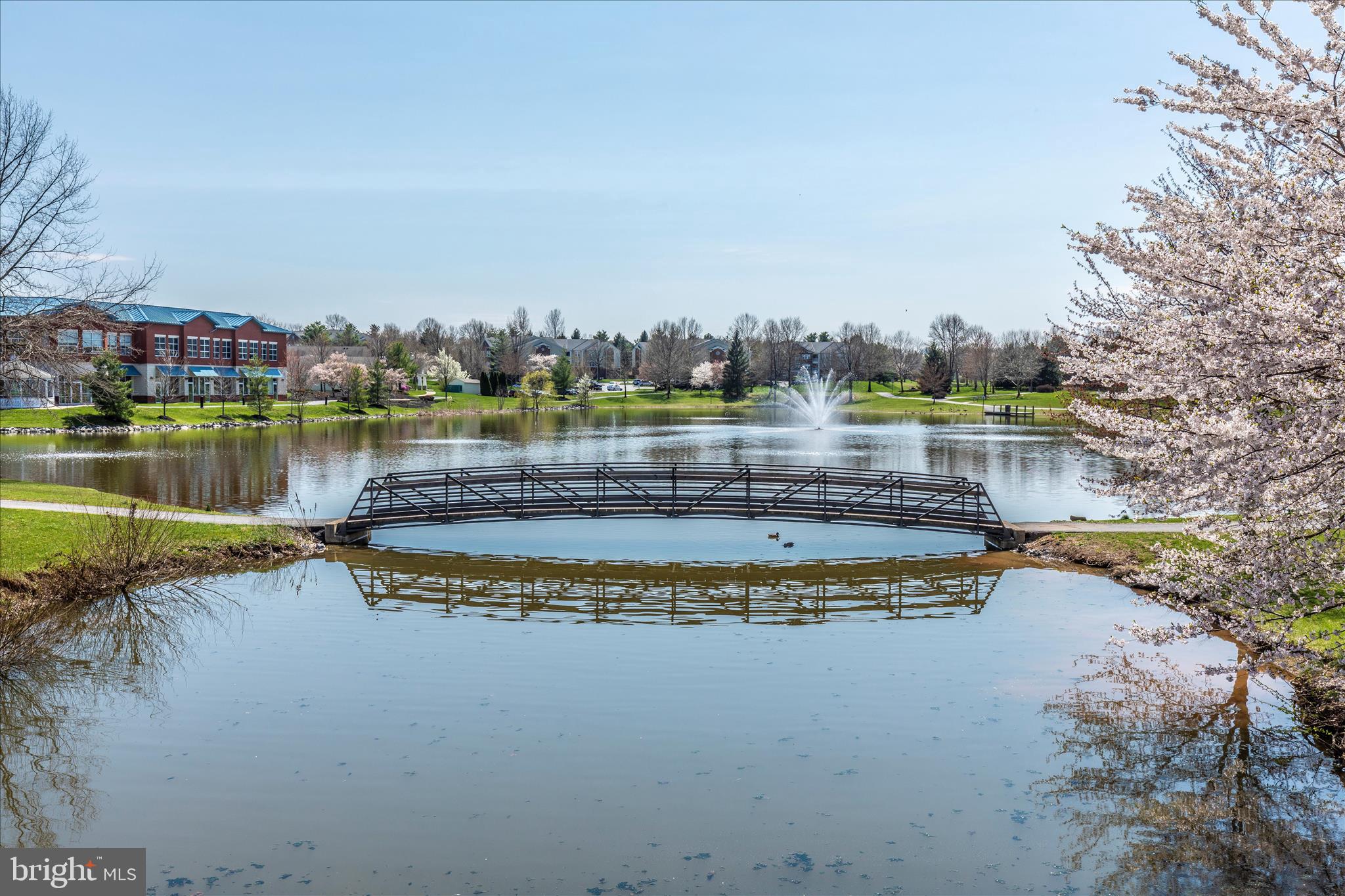 2402 Dominion Drive, Unit 1B Frederick, MD 21702 - Photo 60 of 66 a view of a lake with a big yard