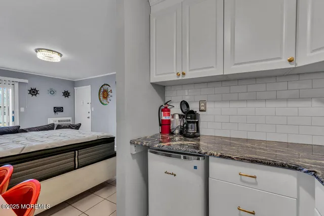 a kitchen with granite countertop cabinets and sink