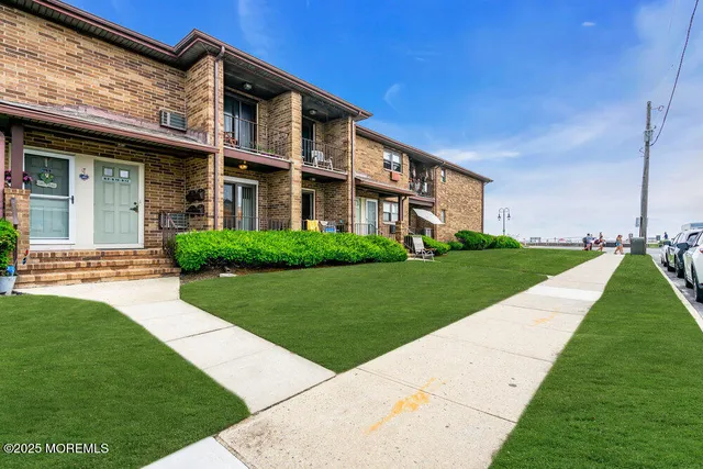 a view of a building next to a big yard