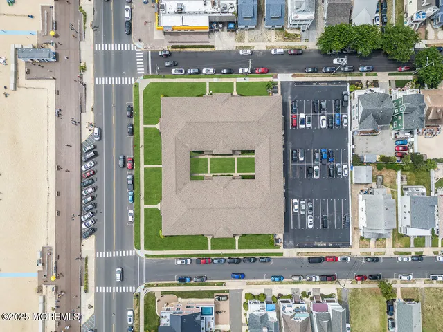 a front view of a building with parking