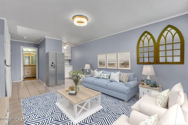 a living room with furniture a chandelier and a window