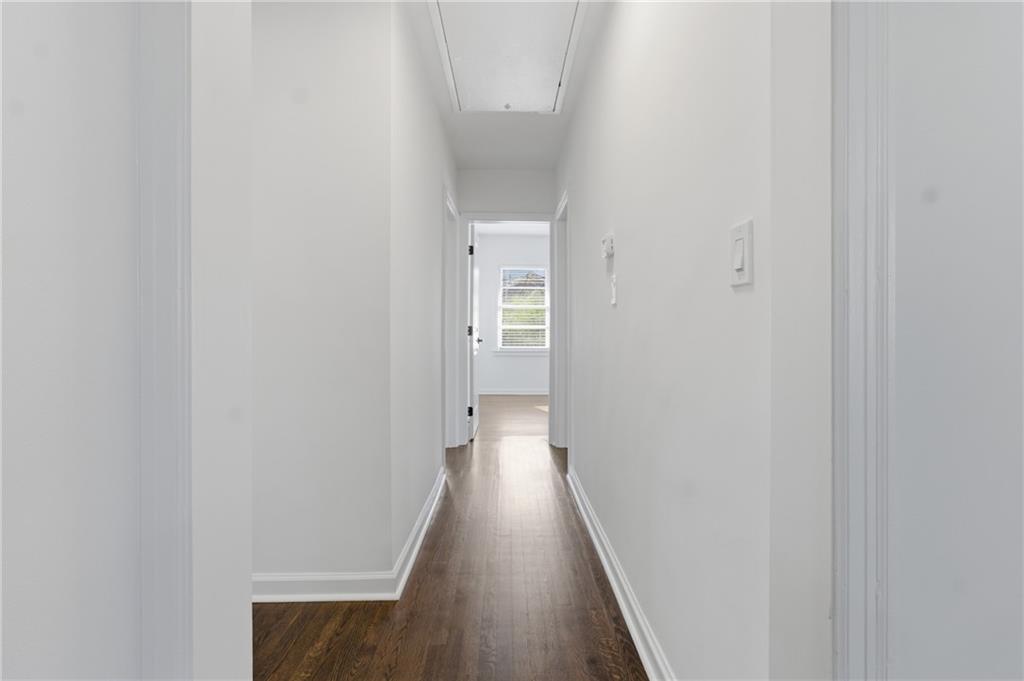 1410 Willis Mill Road Southwest Atlanta, GA 30311 - Photo 12 of 33 a view of a hallway with wooden floor
