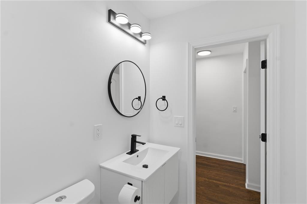 1410 Willis Mill Road Southwest Atlanta, GA 30311 - Photo 14 of 33 a bathroom with a sink and mirror