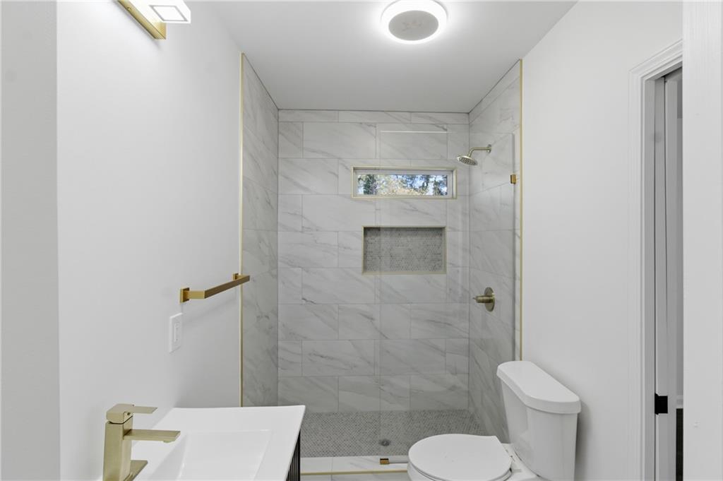 1410 Willis Mill Road Southwest Atlanta, GA 30311 - Photo 19 of 33 a bathroom with a toilet and a sink