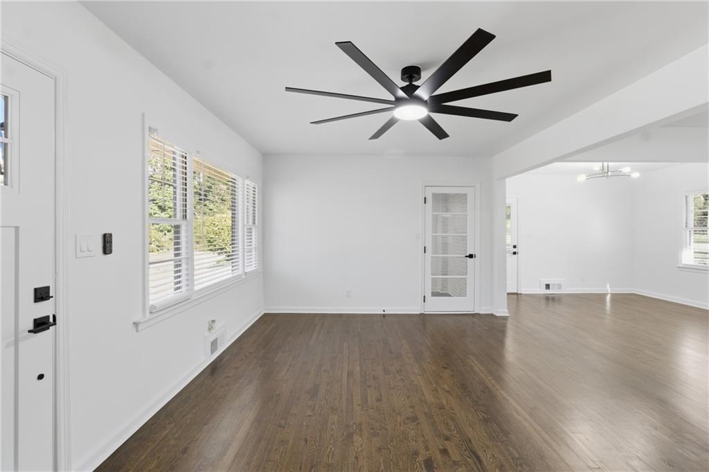 1410 Willis Mill Road Southwest Atlanta, GA 30311 - Photo 2 of 33 a view of a livingroom with a ceiling fan and wooden floor