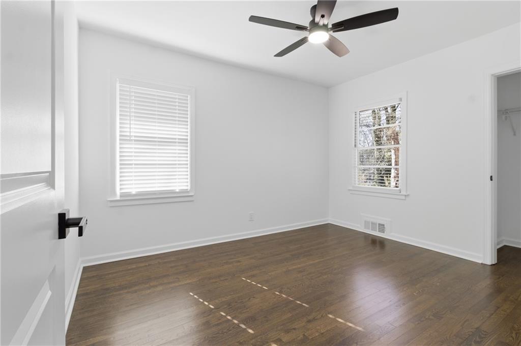 1410 Willis Mill Road Southwest Atlanta, GA 30311 - Photo 21 of 33 wooden floor in an empty room with a window