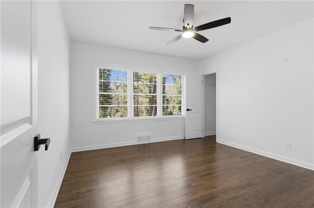 1410 Willis Mill Road Southwest Atlanta, GA 30311 - Photo 23 of 33 wooden floor in an empty room with a window