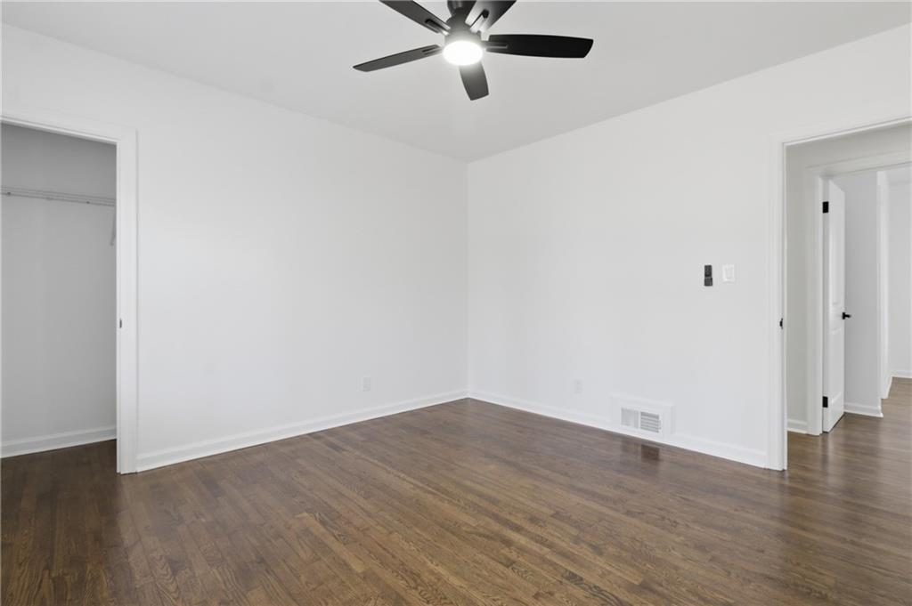 1410 Willis Mill Road Southwest Atlanta, GA 30311 - Photo 24 of 33 a view of an empty room with wooden floor