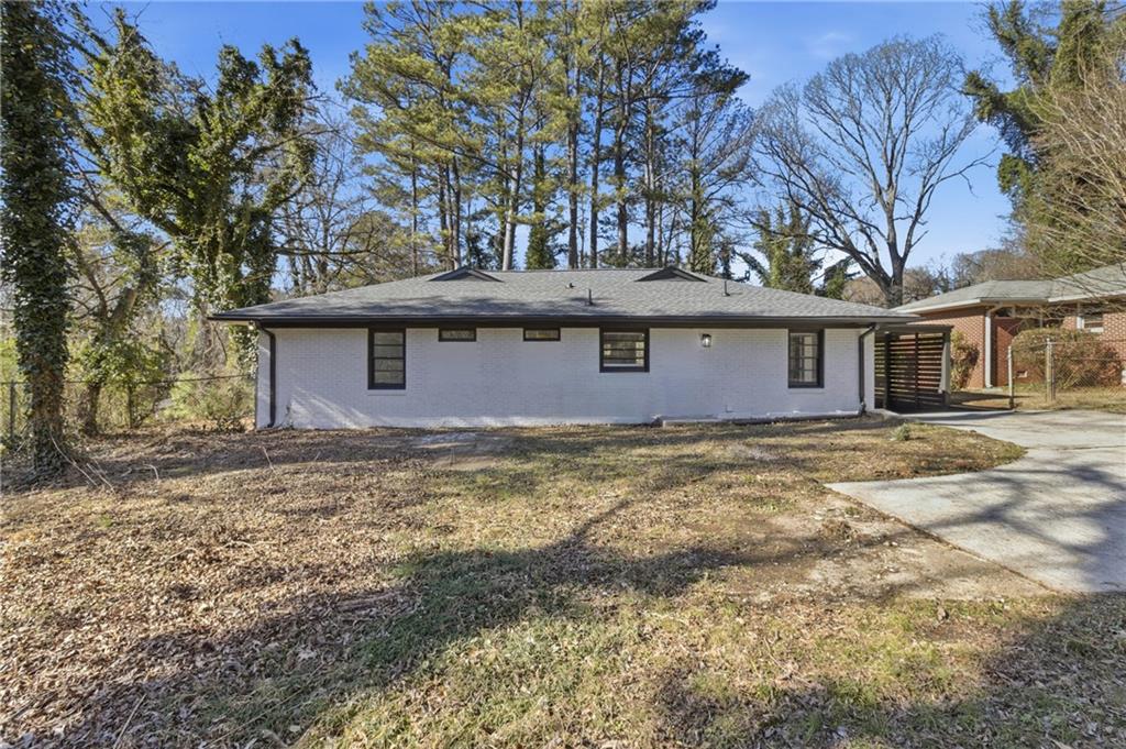 1410 Willis Mill Road Southwest Atlanta, GA 30311 - Photo 29 of 33 a front view of a house with a garden