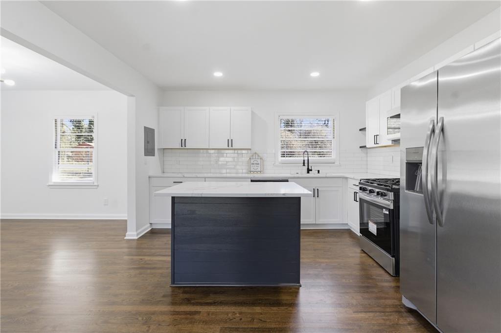 1410 Willis Mill Road Southwest Atlanta, GA 30311 - Photo 5 of 33 a kitchen with a refrigerator sink and cabinets