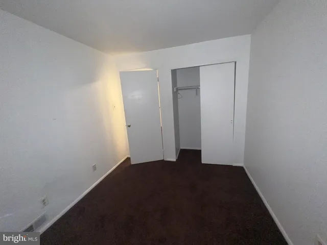 a view of hallway with closet