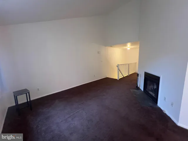 a view of wooden floor and windows in a room