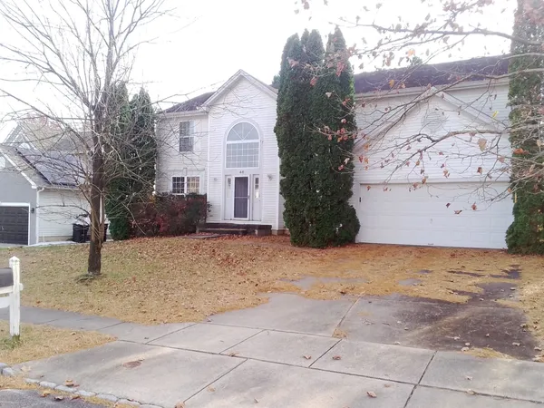 a view of a house with a snow in the yard